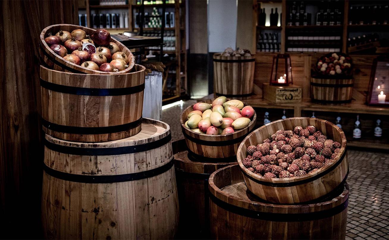 Wooden baskets and barrels filled with fruit